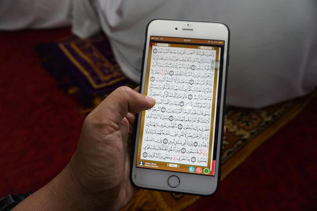 Is Mobile Phone with Quran Stored Inside Permitted in Bathroom?