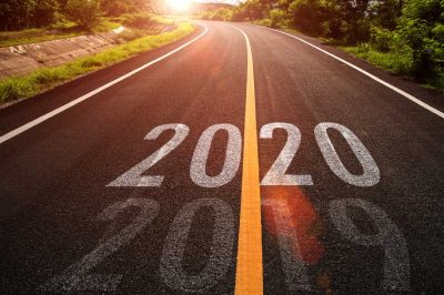 The word 2020 written on highway road