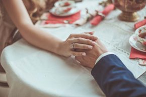 Wedding couple holding hands